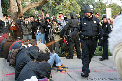 Lt. John Pike using pepper spray on peaceful protesters at UC Davis